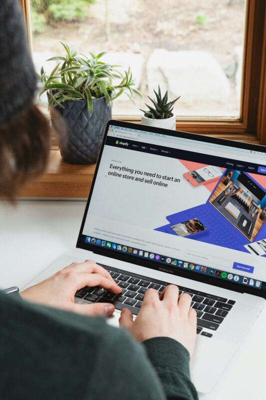 person working on a  laptop at a desk